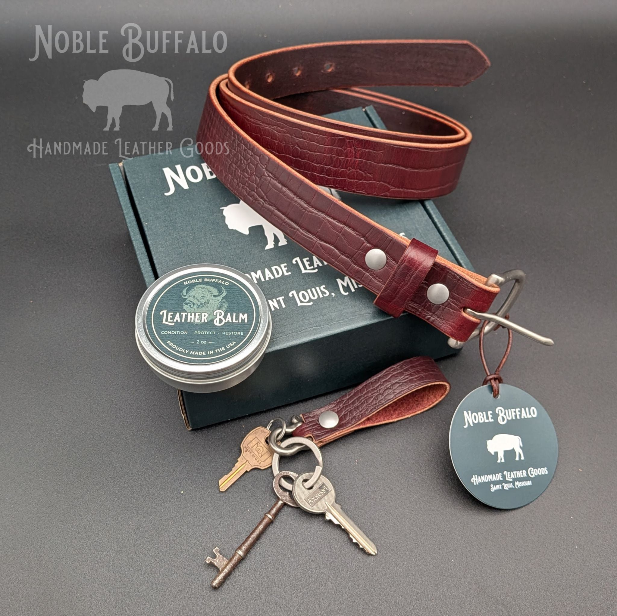 Dark Cherry alligator-embossed leather belt with matching keychain, leather balm, and gift box