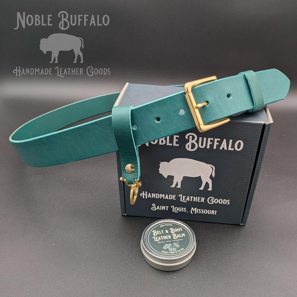Agave teal full grain leather belt handmade in the USA by Noble Buffalo. Blue-green leather belt in agave teal and deep teal tones. Unisex colorful statement leather belt.
