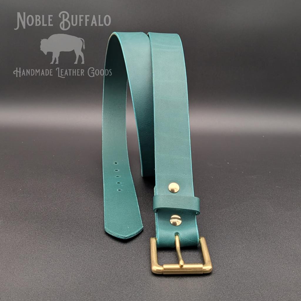 Handmade agave teal leather belt by Noble Buffalo. Rich teal full grain leather belt with blue-green and sea green tones. Colorful unisex leather belt accessory handmade for you in the USA!