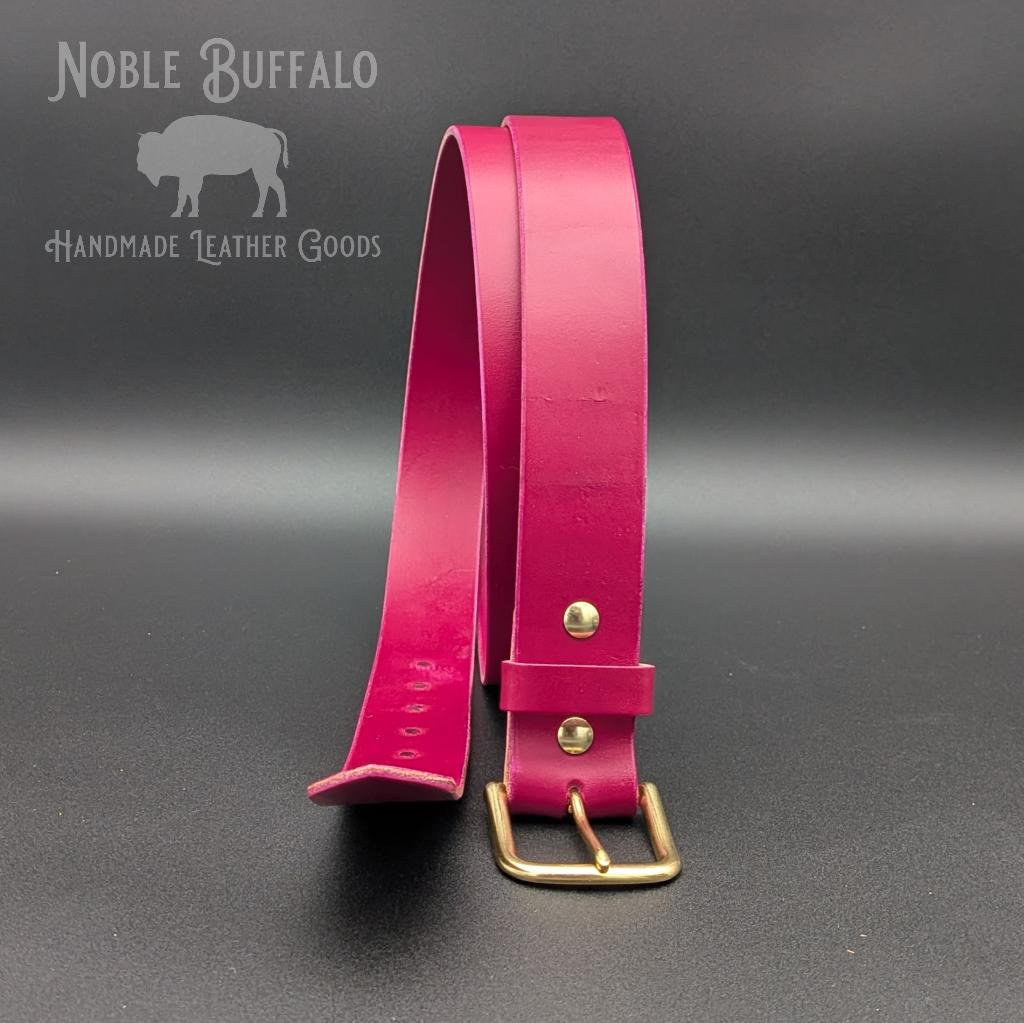 Handmade amaranth purple leather belt by Noble Buffalo. Bold reddish purple full grain leather belt with warm plum and wine purple tones. Colorful unisex leather belt accessory handmade for you in the USA - St. Louis, MO.