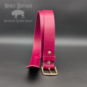 Handmade amaranth purple leather belt by Noble Buffalo. Bold reddish purple full grain leather belt with warm plum and wine purple tones. Colorful unisex leather belt accessory handmade for you in the USA - St. Louis, MO.