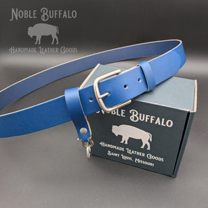 Handmade bluebonnet blue leather belt by Noble Buffalo. Vibrant bright blue full grain leather belt with rich royal and cobalt tones. Colorful unisex leather belt accessory.