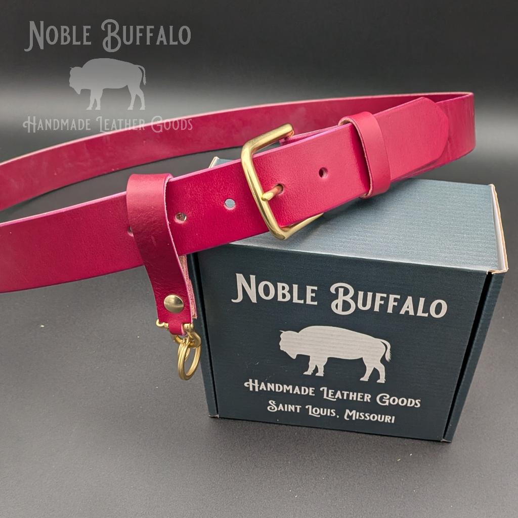 Amaranth purple full grain leather belt handmade in the USA by Noble Buffalo. Rich purple leather belt in amaranth and plum purple tones. Unisex colorful statement leather belt.