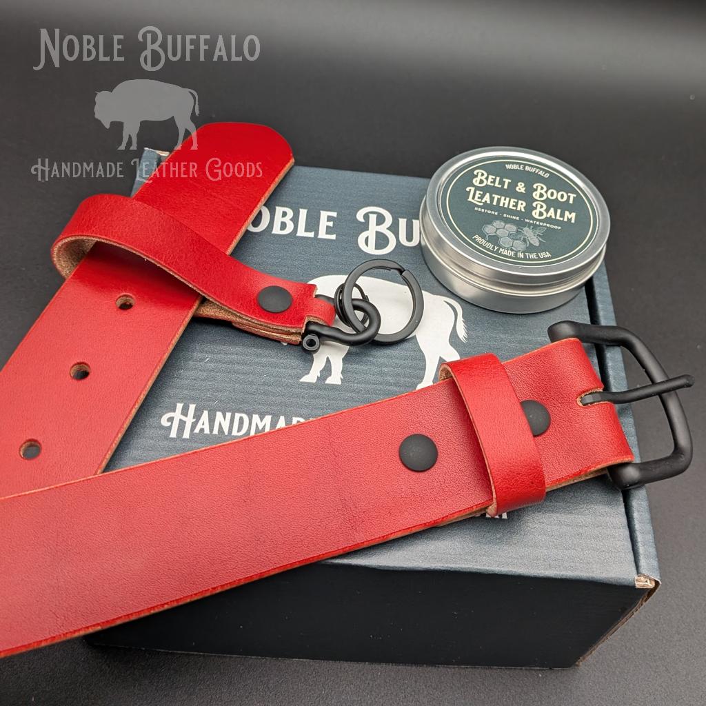 Handmade poppy red leather belt by Noble Buffalo. Vibrant red full grain leather belt with warm cherry and cardinal red tones. Colorful unisex leather belt accessory.