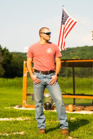 Men’s everyday brown leather belt worn with jeans and boots, handmade by Noble Buffalo in St. Louis, Missouri