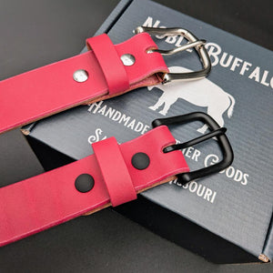 Handmade cactus flower pink leather belt by Noble Buffalo. Bold pink full grain leather belt with bright rose and magenta tones. Colorful unisex leather belt accessory.