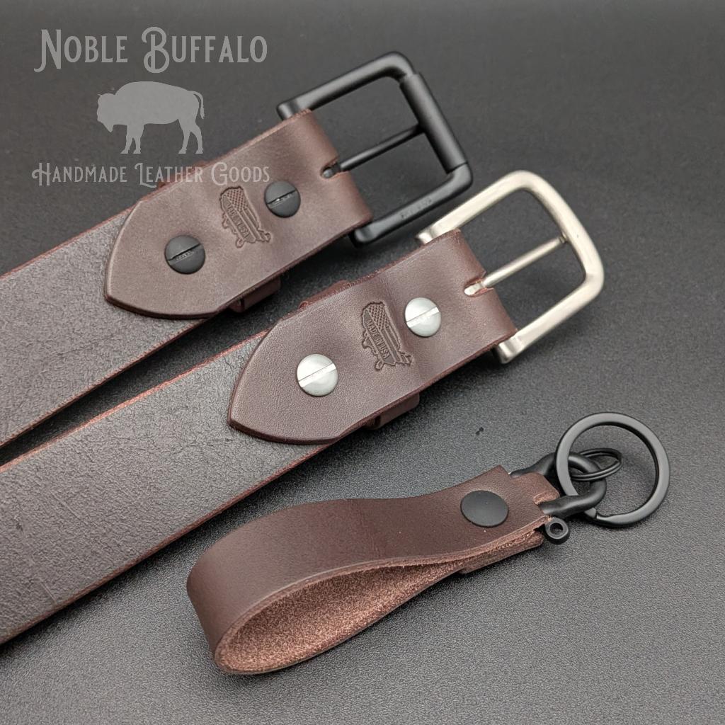 Handmade smoked walnut brown leather belt by Noble Buffalo. Deep dark brown full grain leather belt with smoky espresso and ash brown tones. Classic unisex leather belt accessory.