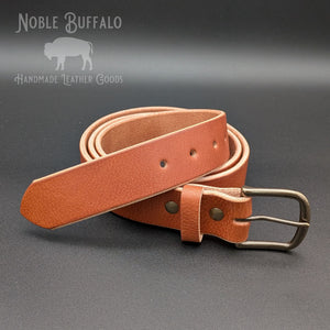 Handmade brown latigo leather belt with milled deerhide texture and brass buckle, burnished edges by Noble Buffalo
