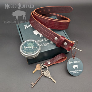 Dark Cherry alligator-embossed leather belt with matching keychain, leather balm, and gift box