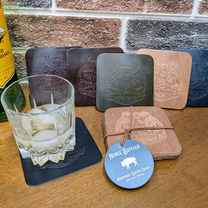 Set of handmade leather coasters in black, burgundy, green, navy, natural, and brown, full grain leather with embossed detail for rugged everyday use